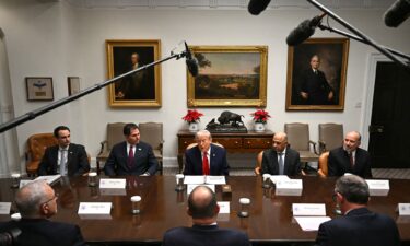 President Donald Trump speaks during a roundtable discussion in the Roosevelt Room of the White House on December 10.