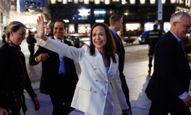 Nobel Peace Prize Laureate María Corina Machado waves to supporters as she walks through Oslo