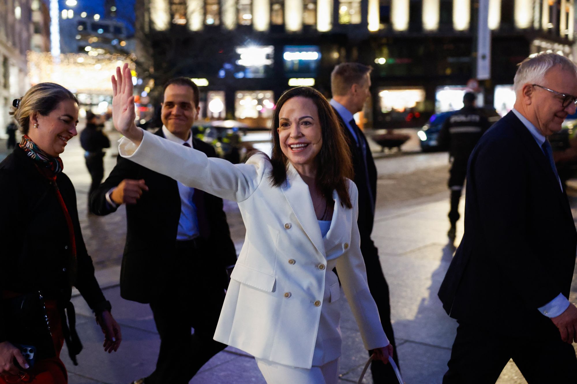 <i>Odd Andersen/AFP/Getty Images via CNN Newsource</i><br/>Nobel Peace Prize Laureate María Corina Machado waves to supporters as she walks through Oslo