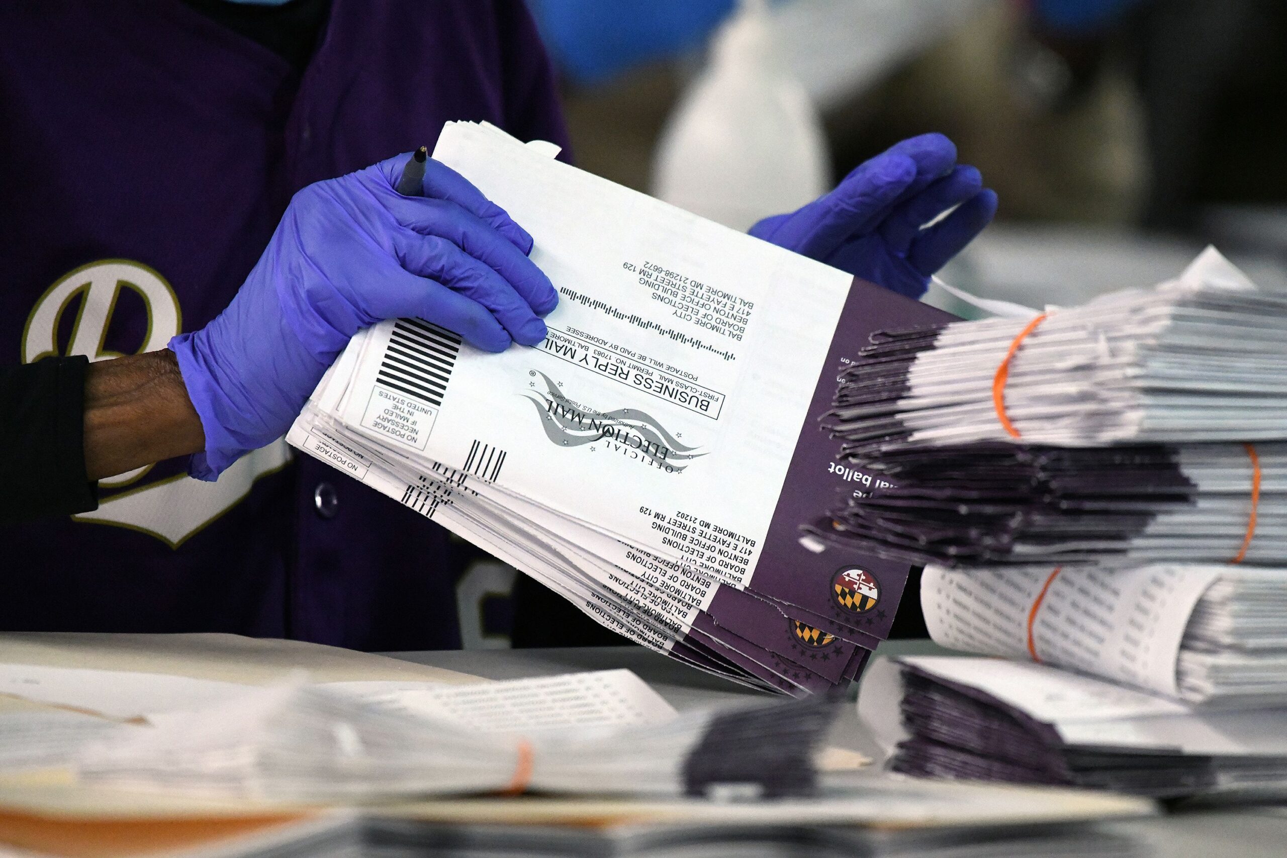 <i>Baltimore Sun/Tribune News Service/Getty Images via CNN Newsource</i><br/>Canvassers open and review mail-in and absentee ballots for the 2024 General Election at the Baltimore City Board of Elections warehouse in November 2024.