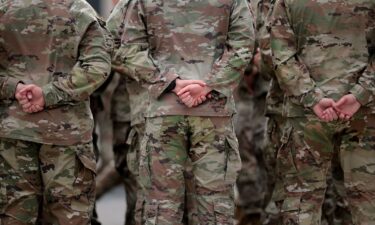 US Army soldiers lineup in formation as they conduct drills ahead of tomorrow's 250th anniversary parade in Washington