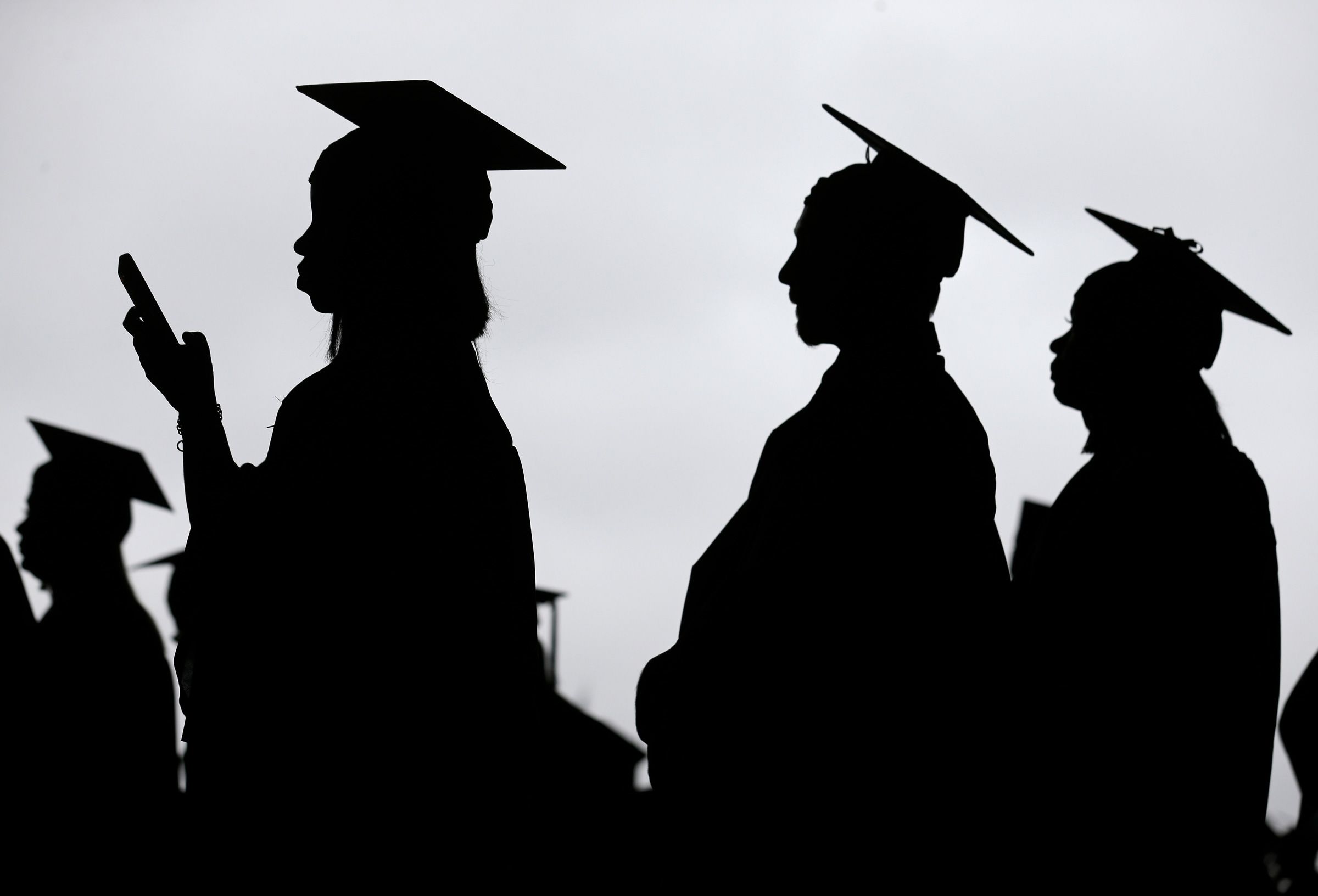 <i>Seth Wenig/AP/File via CNN Newsource</i><br/>New graduates line up before the start of the Bergen Community College commencement at MetLife Stadium in East Rutherford