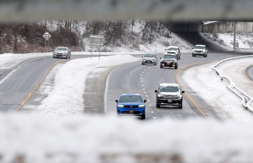 Traffic moves along southbound Interstate 684 in snowy Katonah