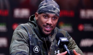 Boxer Anthony Joshua speaks at a press conference after Jake Paul v Anthony Joshua at Kaseya Center in Miami