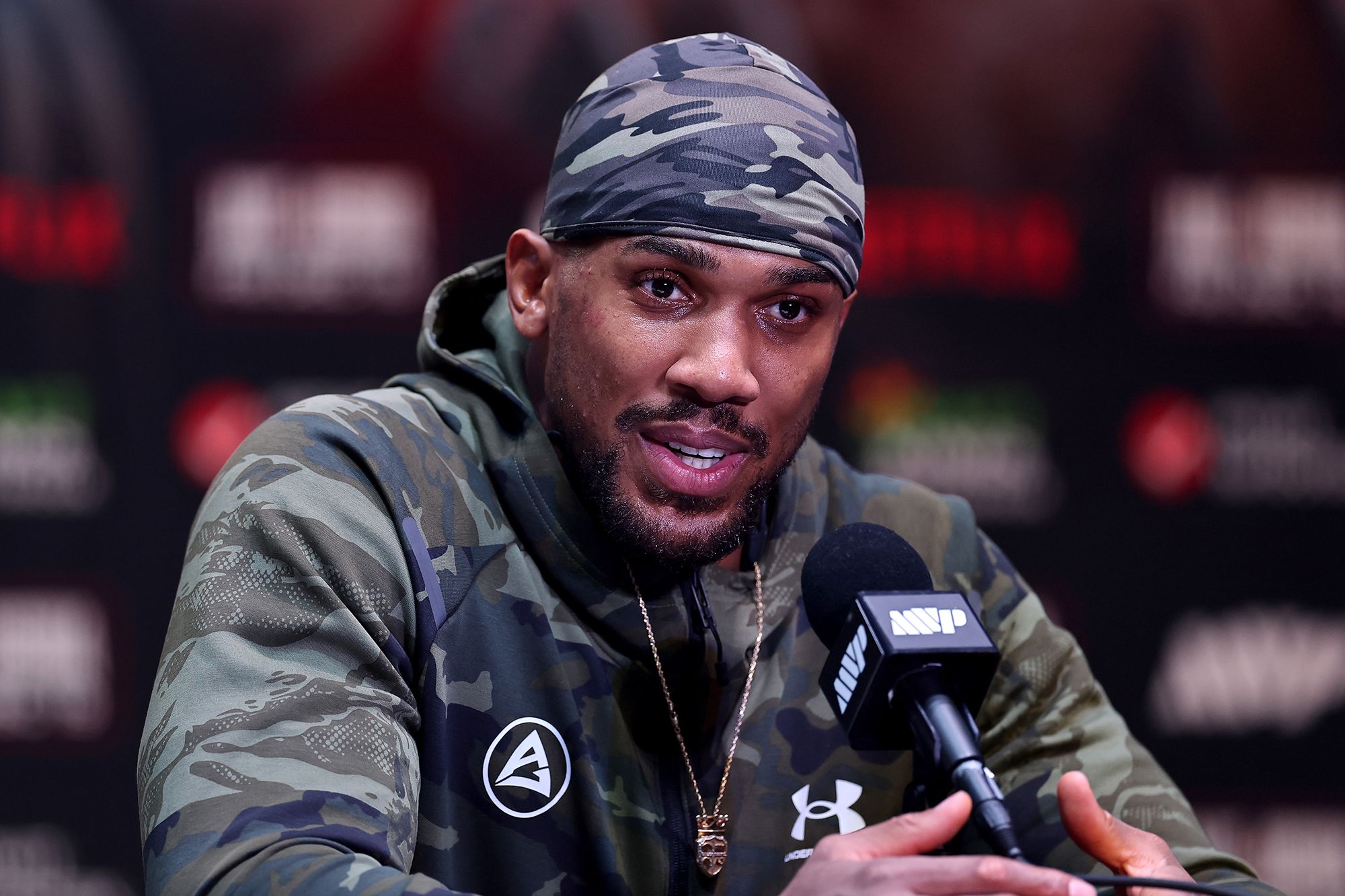 <i>Carmen Mandato/Getty Images via CNN Newsource</i><br/>Boxer Anthony Joshua speaks at a press conference after Jake Paul v Anthony Joshua at Kaseya Center in Miami