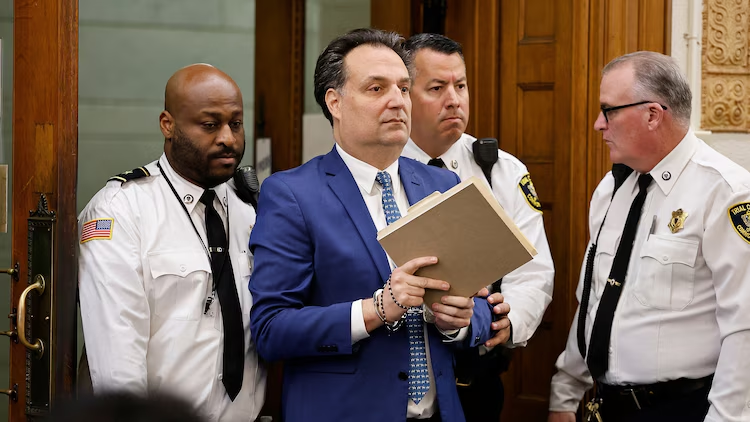 Brian Walshe is escorted into court for the afternoon session of the first day of the Brian Walshe murder trial in Norfolk Superior Court, Dec. 1, 2025, in Dedham, Mass.
