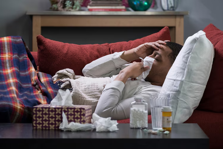 Stock image of a person ill with the flu.