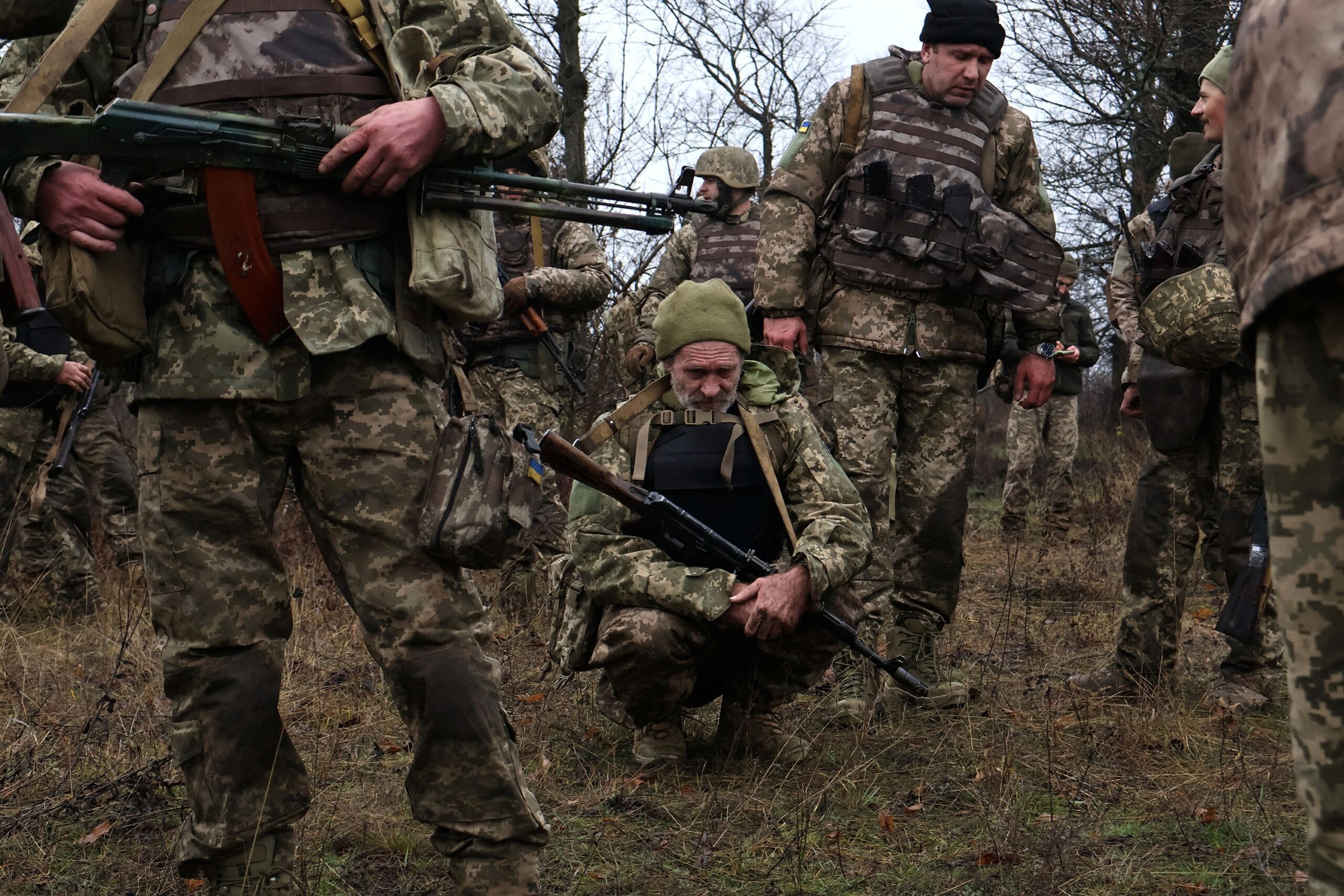 <i>Andriy Andriyenko/Press Service of the 65th Separate Mechanized Brigade of the Ukrainian Armed Forces/Reuters via CNN Newsource</i><br/>Service members with Ukraine's 65th Separate Mechanized Brigade rest during their first military drill as recruits near the front line in Zaporizhzhia region