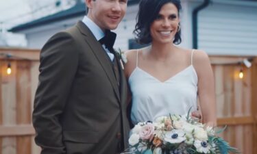 Spencer and Monique Tepe pose on their wedding day.