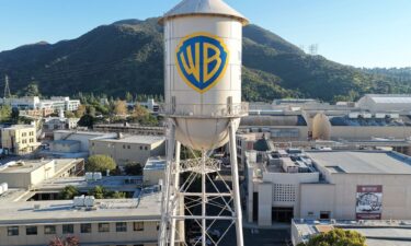 An aerial view of the Warner Bros. logo displayed on the water tower at Warner Bros. Studio in Burbank