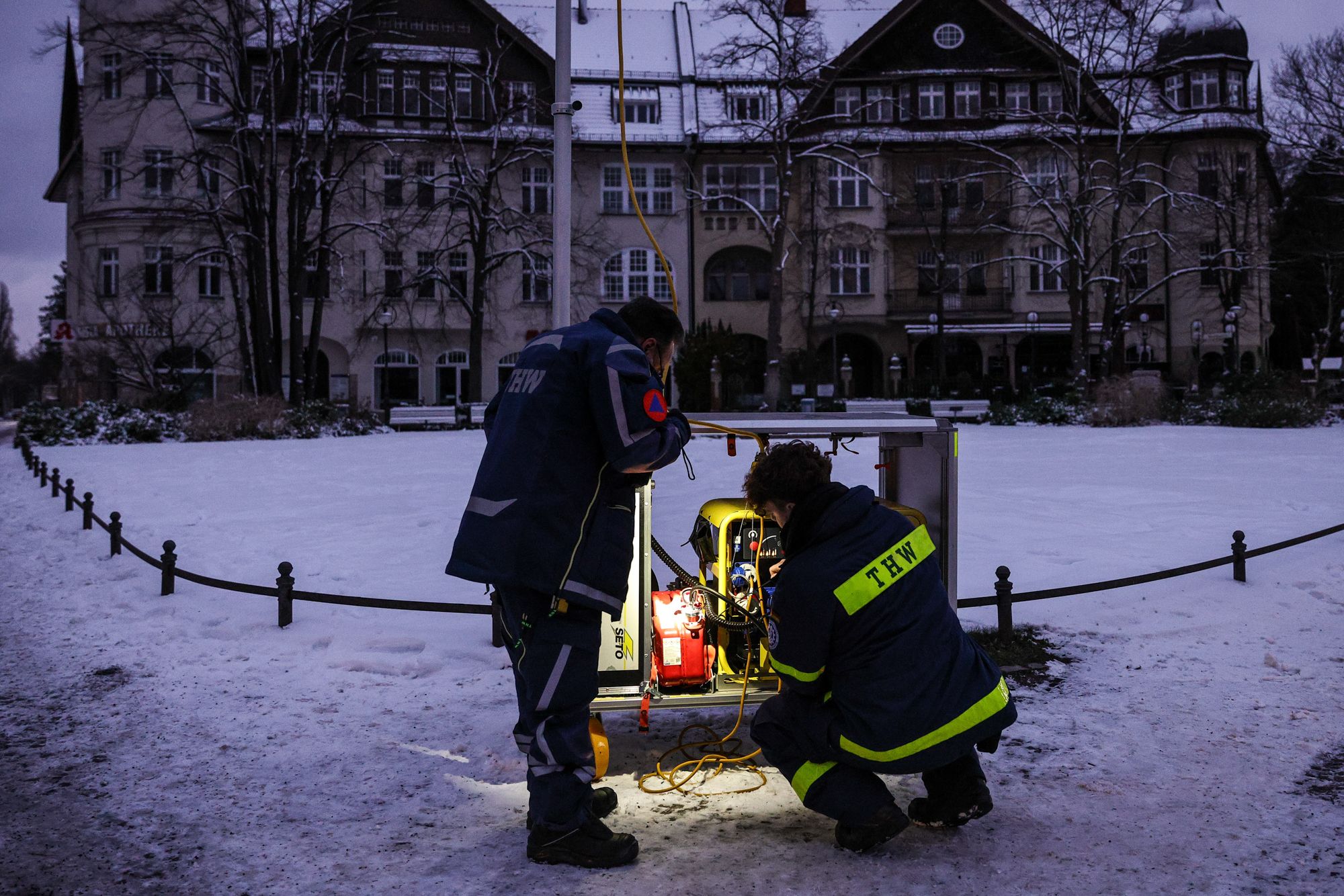 <i>Ralf Hirschberger/AFP/Getty Images via CNN Newsource</i><br/>Some battery-operated Christmas decorations are seen in windows of a residential building in the Zehlendorf district on Sunday morning amid a power blackout.