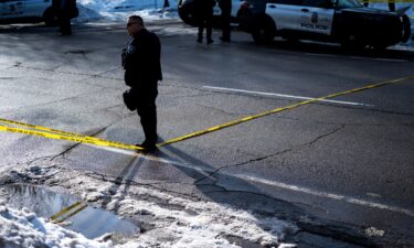 A bullet hole is seen in the windshield of a vehicle involved in a shooting by an ICE agent during federal law enforcement operations on Wednesday in Minneapolis.