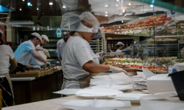 Pedestrians move along Lexington Avenue in the Manhattan borough of New York City on December 16