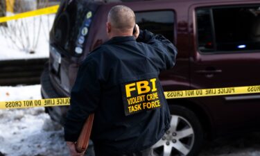 An FBI agent at the scene of the shooting in Minneapolis.