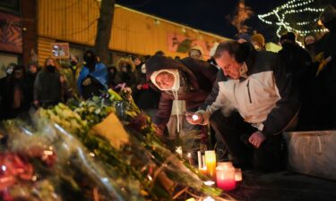 Federal agents stand guard at the scene of a shooting involving immigration agents in Minneapolis