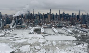 Ice-covered trees and downed power lines block a road in Nashville on January 26.