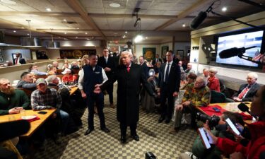 People shop for fruit in a grocery store in the Manhattan borough of New York City on December 13