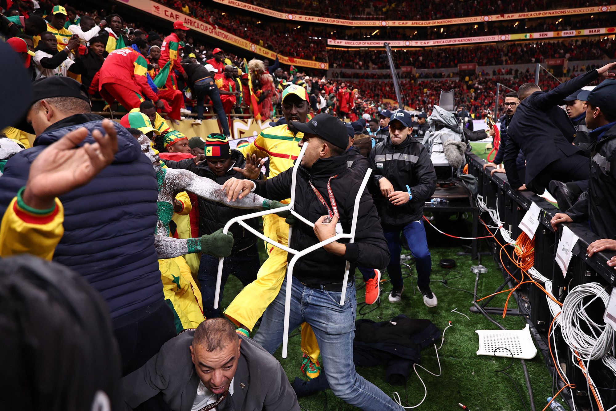 <i>Abdel Majid Bziouat/AFP/Getty Images via CNN Newsource</i><br/>Senegal and Morocco players clash during the Africa Cup of Nations final.