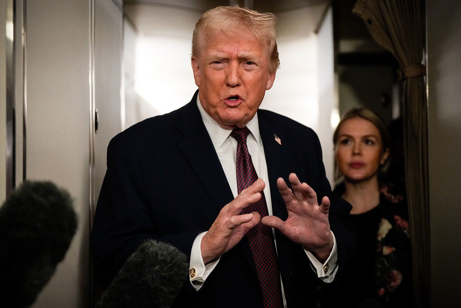President Donald Trump speaks to reporters on Air Force One en route to Joint Base Andrews, Maryland, on January 11.