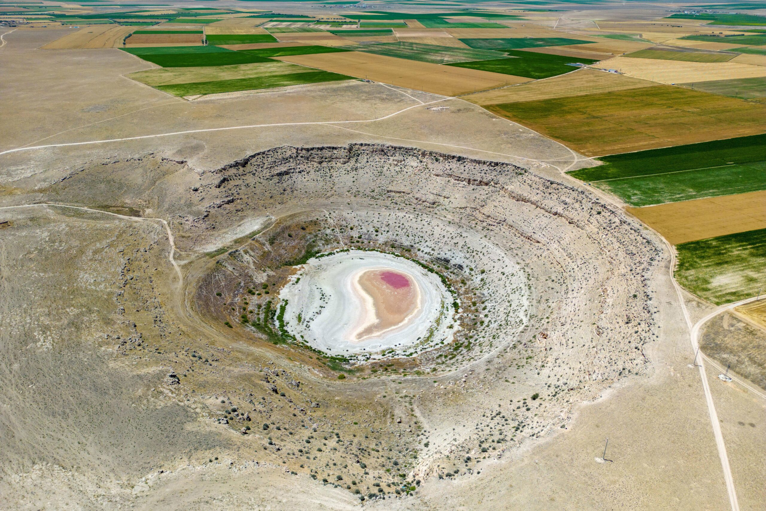 <i>Elke Scholiers/Getty Images via CNN Newsource</i><br/>A girl with canisters of water from a water truck