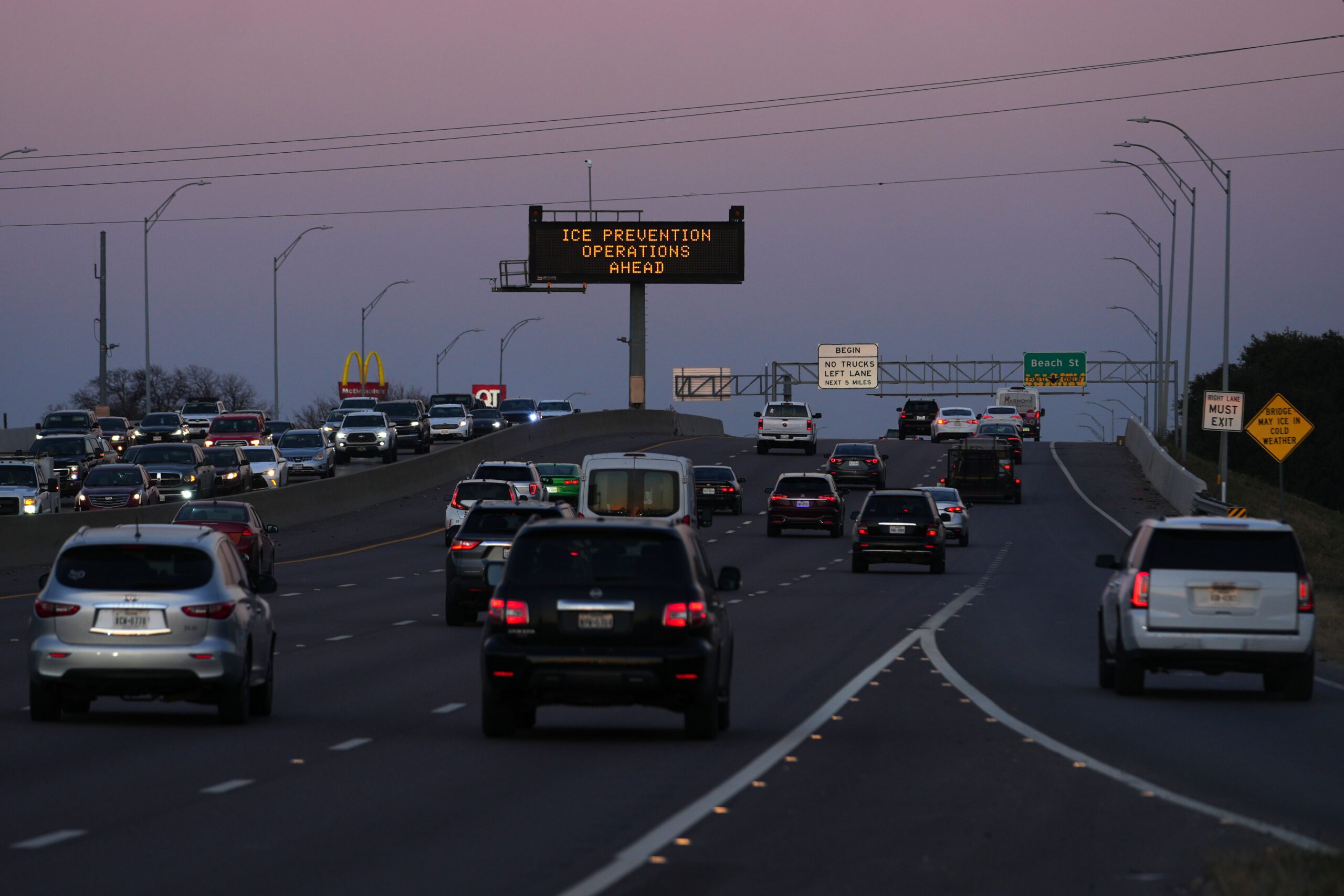 <i>Julio Cortez/AP via CNN Newsource</i><br/>A sign visible from the eastbound lanes of Highway 121 warns of road preparations ahead of inclement weather expected in the region on Wednesday in Fort Worth