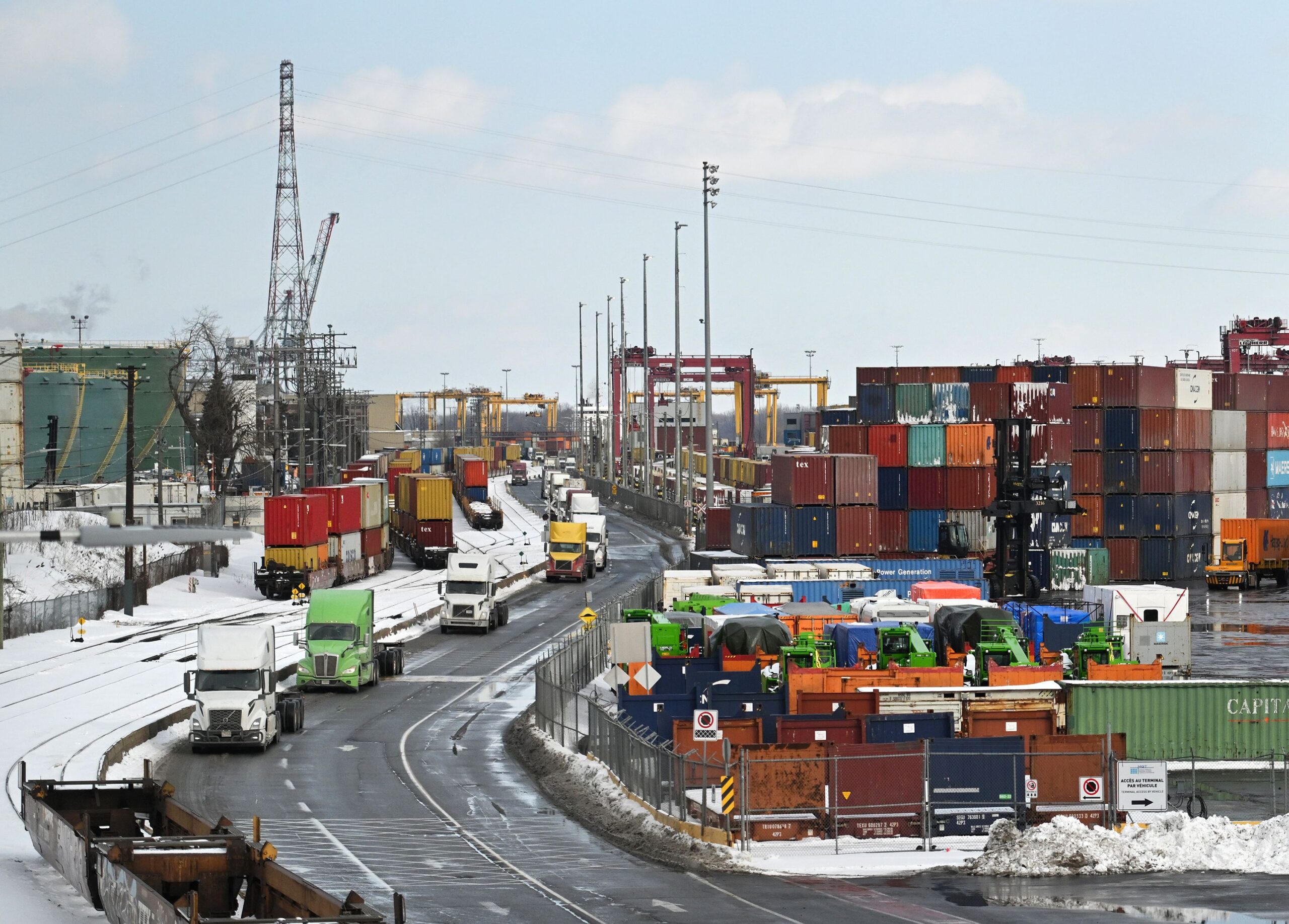 <i>Graham Hughes/Bloomberg/Getty Images via CNN Newsource</i><br/>Trucks and shipping containers at the Port of Montreal in Montreal