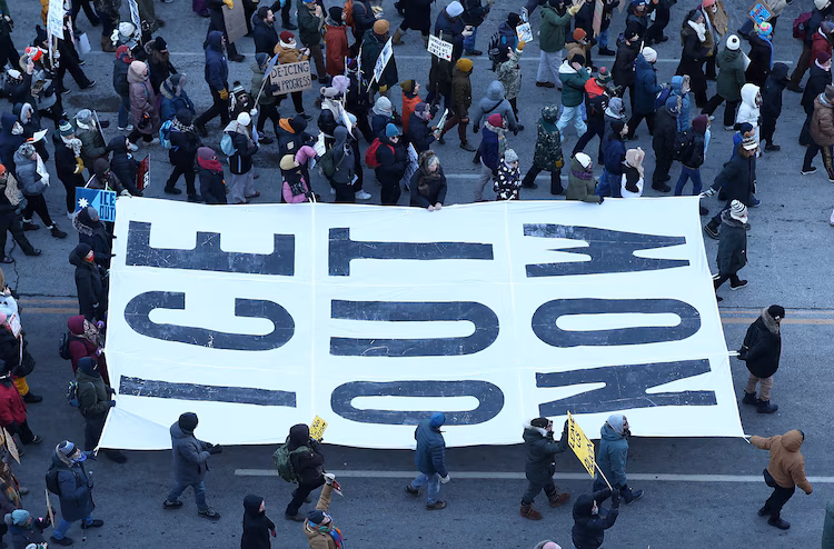 People partake in a "National Shutdown" protest against US Immigration and Customs Enforcement in Minneapolis, January 30, 2026.