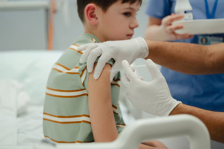 Stock photo of a child getting a shot.