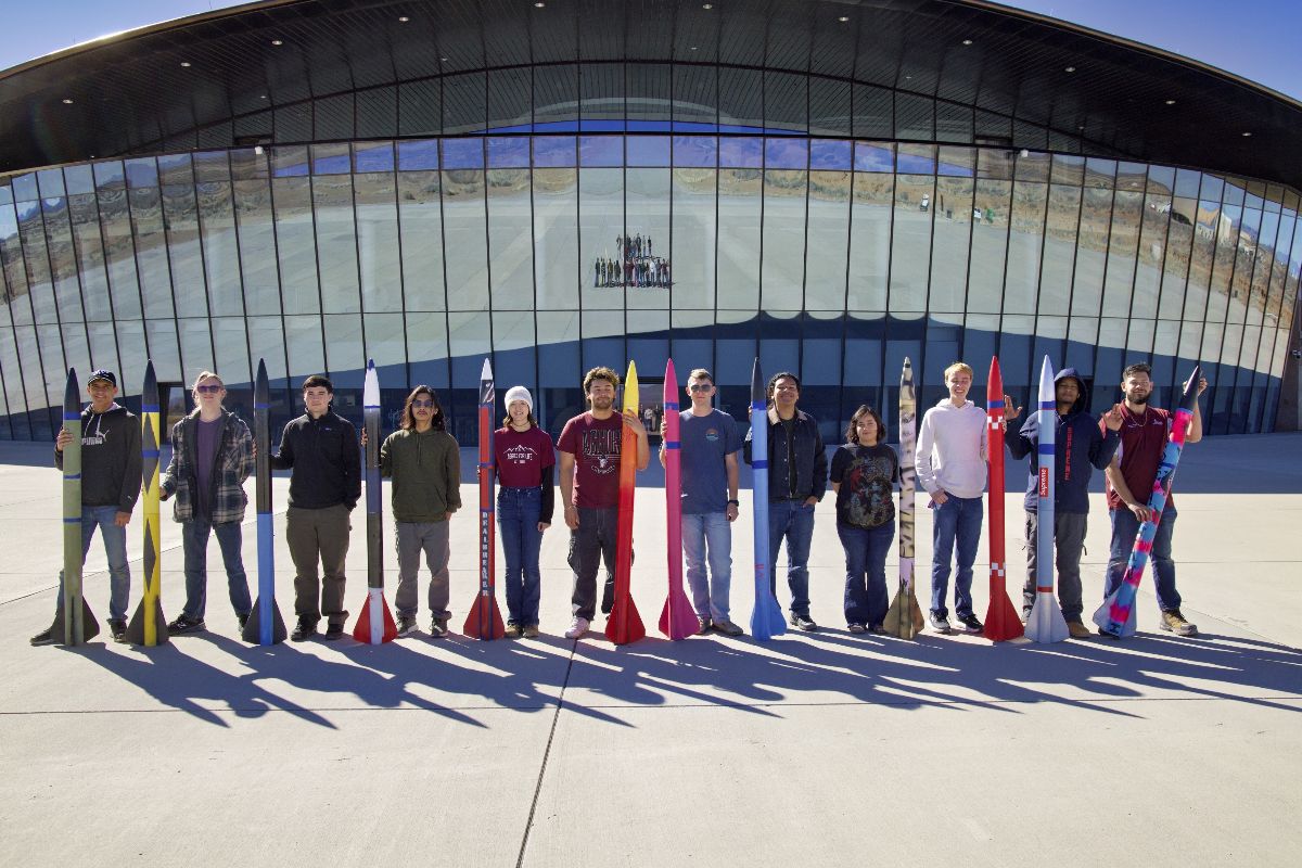 New Mexico State University students pose with their rockets ahead of a series of NAR certification flights at Spaceport America on Saturday, Feb. 14, 2026 
