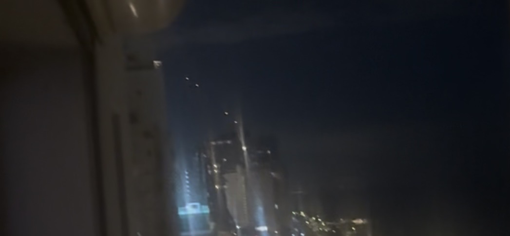 Photo of Israel horizon with four light source, appear to be missiles or a defense system firing. 