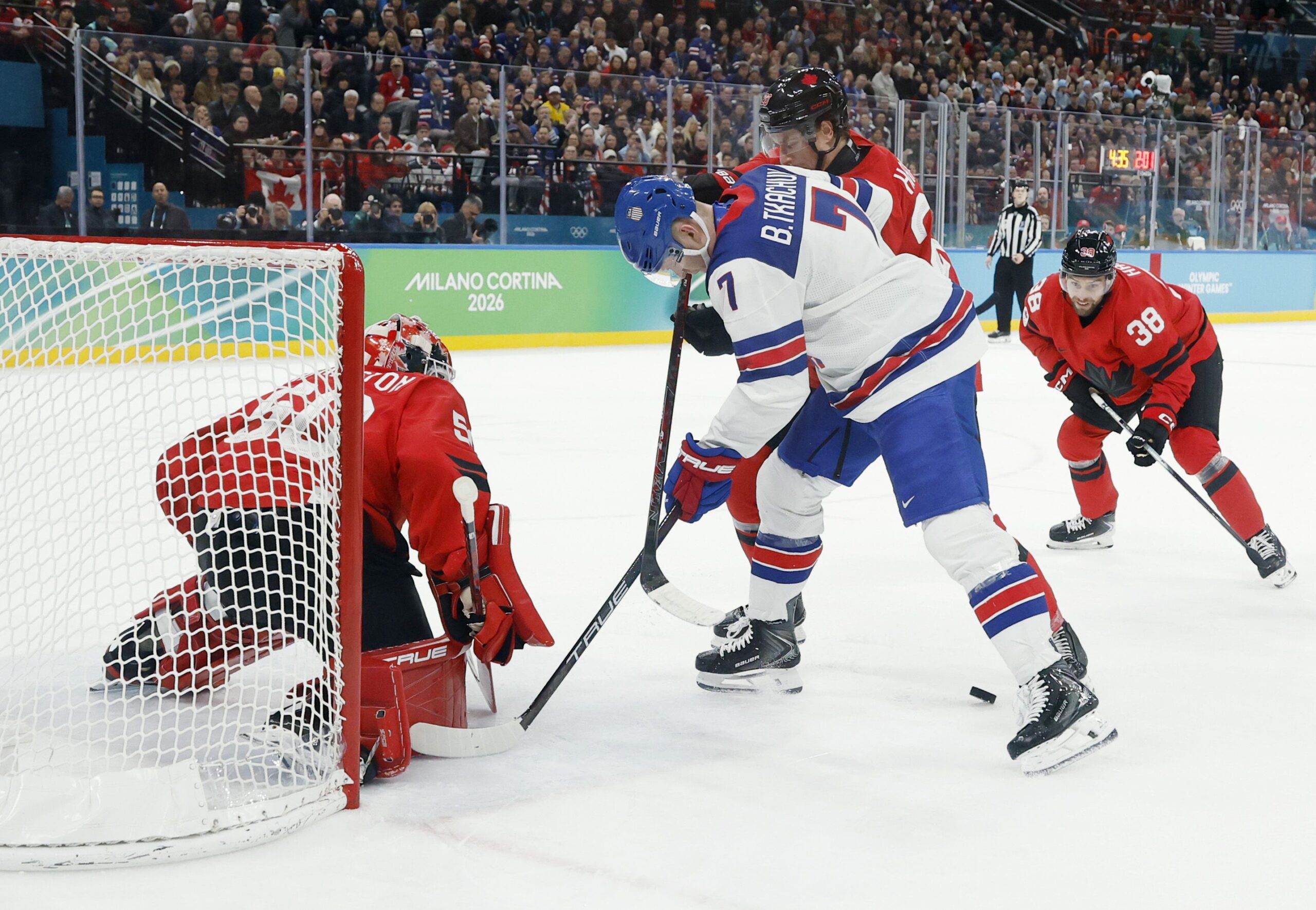 <i>Geoff Burke/Imagn Images via CNN Newsource</i><br/>Jordan Binnington of Canada makes a save against Brady Tkachuk of the United States in the men's ice hockey gold medal game during the Milano Cortina 2026 Olympic Winter Games in Milan