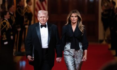 President Donald Trump and first lady Melania Trump arrive at the National Governors Association dinner at the White House