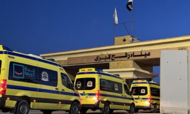 Ambulances wait in line at the Egyptian side of the Rafah border crossing with Gaza on Monday.