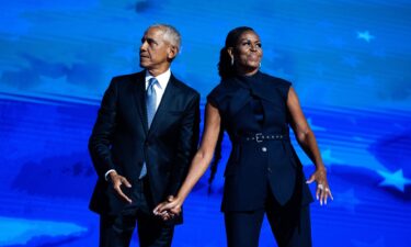 Former President Barack Obama and former first lady Michelle Obama appear on stage on the second night of the Democratic National Convention at the United Center in Chicago on August 20