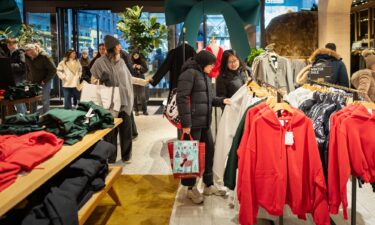 Last-minute Christmas shoppers browse in Aritzia on December 24