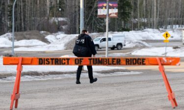 A Canadian flag is lowered to half-staff at the Guy-Favreau Complex in Montreal