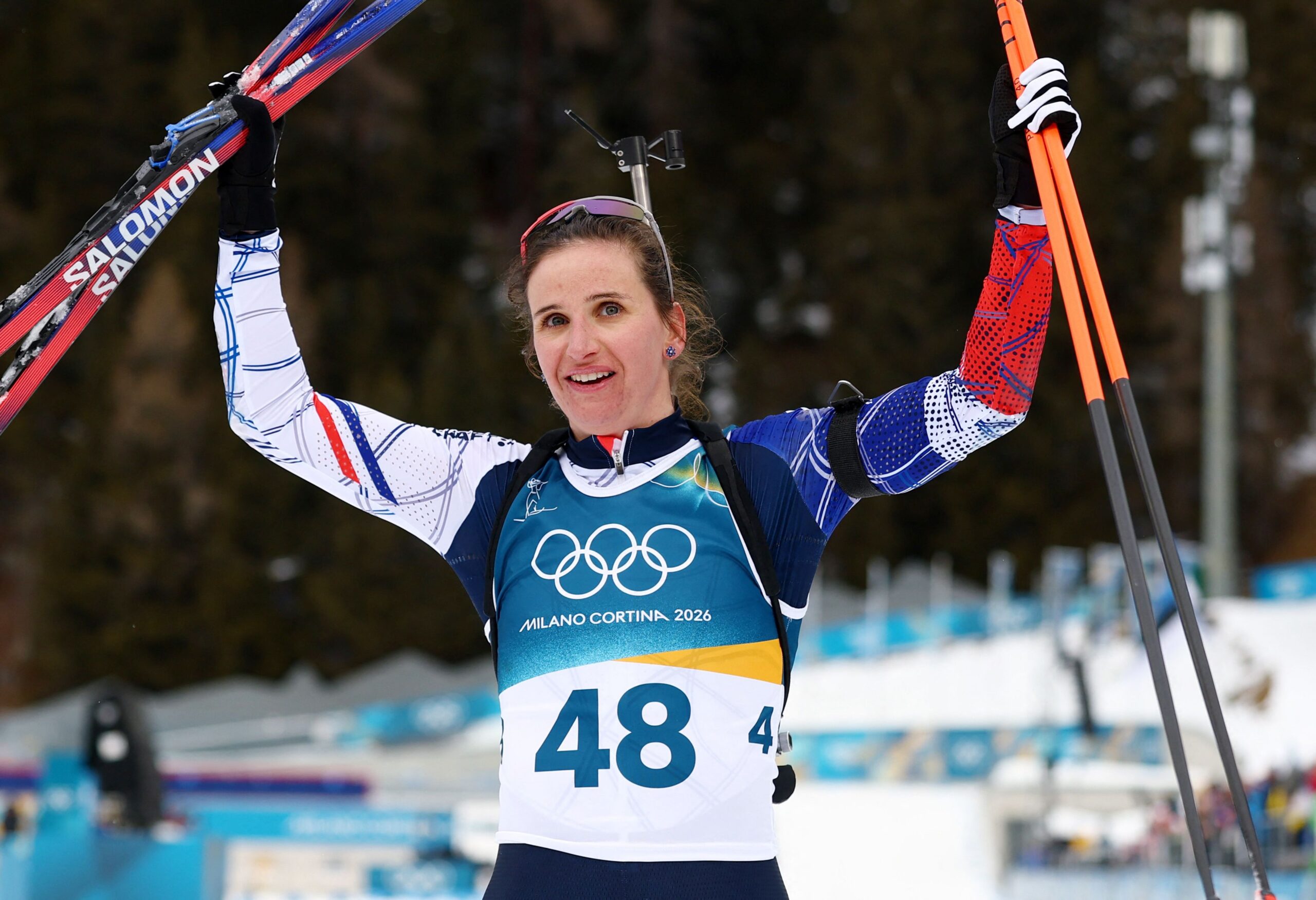 <i>Matthew Childs/Reuters via CNN Newsource</i><br/>French biathlete Julia Simon celebrates after crossing the finish line to win gold on Wednesday.