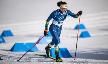 Greece's Nefeli Tita (R) and Moura react in the finish area during the women's 10km interval start free on February 12.
