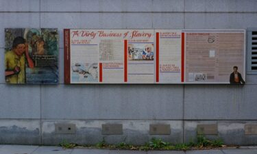 Signage about slavery is displayed on an outdoor exhibit at Independence National Historical Park in Philadelphia