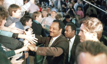 Presidential candidate Jesse Jackson shakes hands with supporters during a campaign stop in Hazard