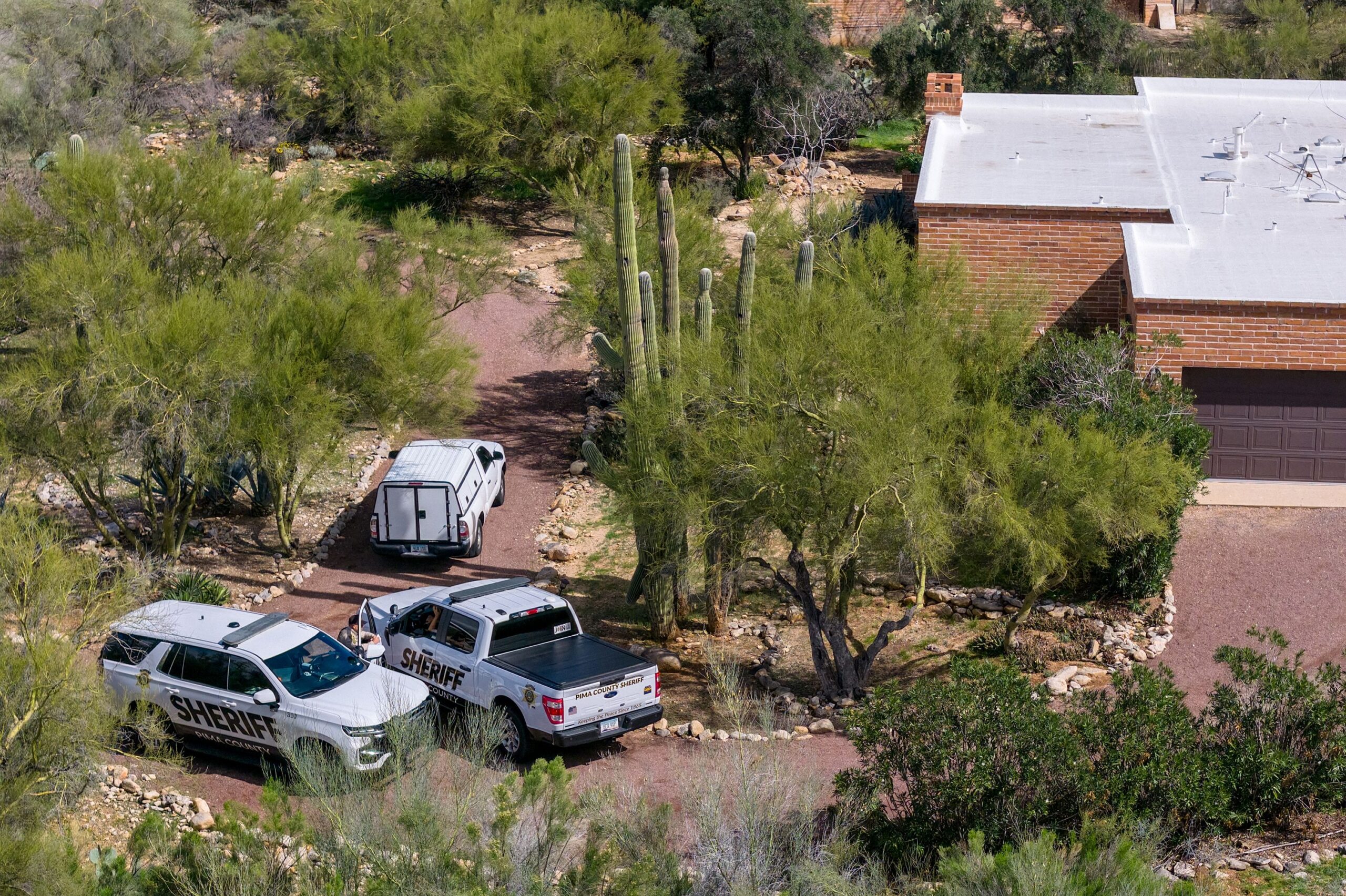 In an aerial view, Pima County sheriff's officers gather on Nancy Guthrie's property on February 17 in Tucson, Arizona.