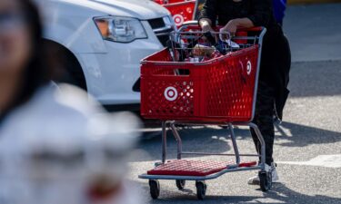A shopper pushes a cart outside a Target store in Emeryville