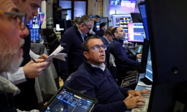 Traders work on the floor at the New York Stock Exchange on Monday