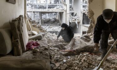 A man pumps gas at a Shell station as the price of oil and gas has surged amid the U.S.-Israeli conflict with Iran
