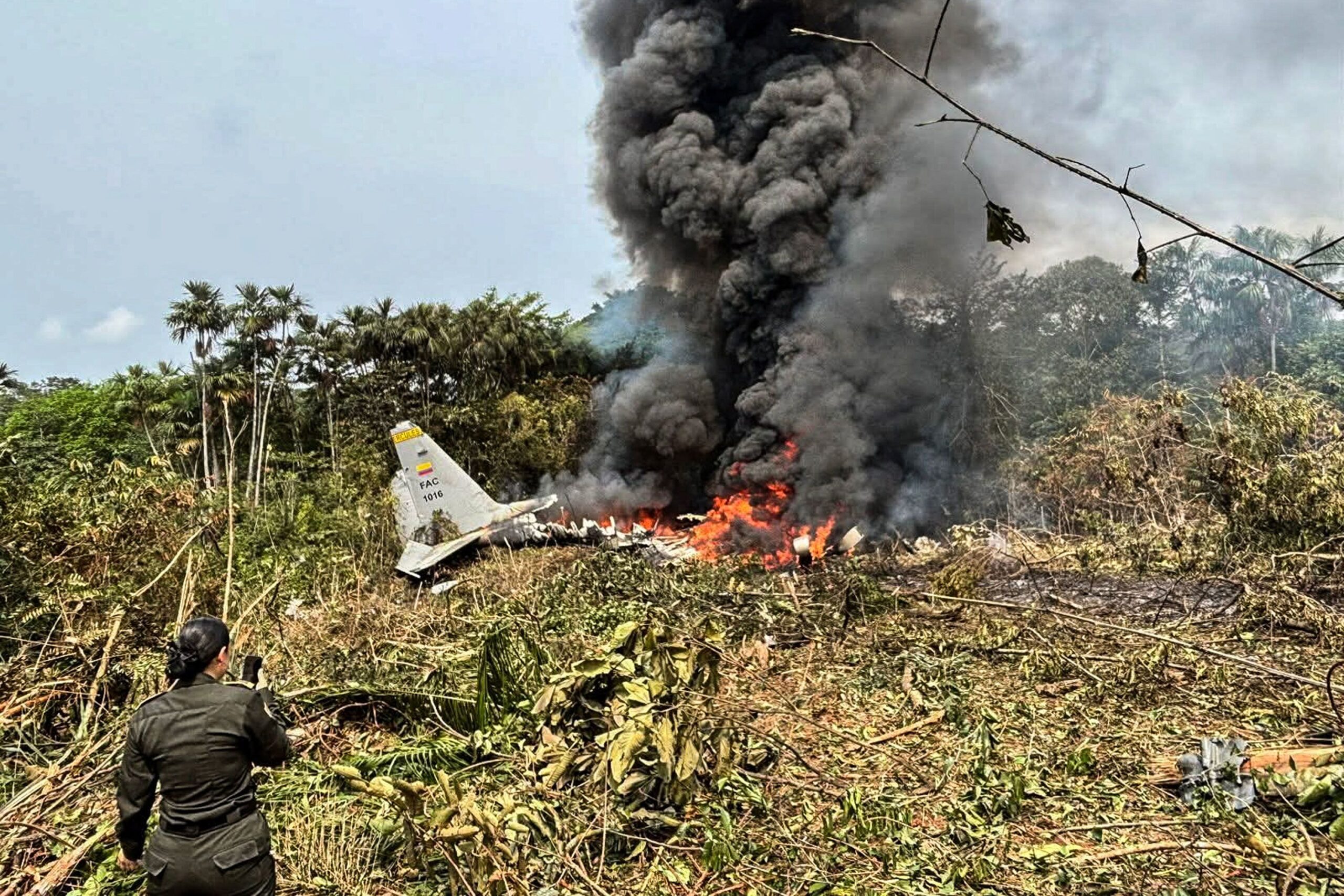 Flames and thick black smoke rise from the Colombian military plane that crashed in Puerto Leguizamo, near the border with Ecuador, on March 23.