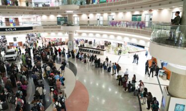Federal immigration agents are seen at Hartsfield-Jackson Atlanta International Airport on Monday.