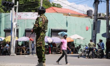 A Kenyan police officer patrols as the country is facing emergency food insecurity while immersed in a social and political crisis