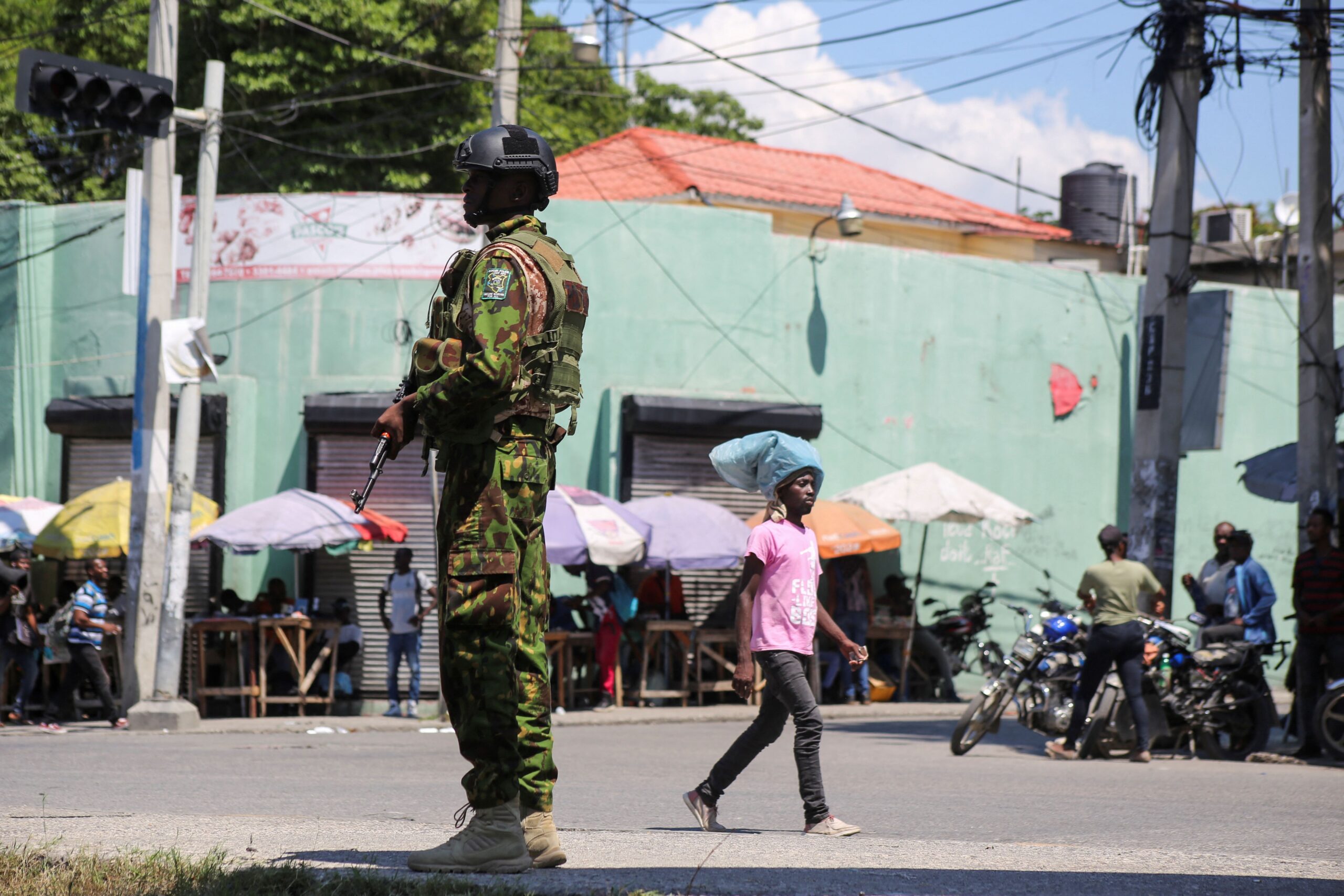 <i>Jean Feguens Regala/Reuters via CNN Newsource</i><br/>A Kenyan police officer patrols as the country is facing emergency food insecurity while immersed in a social and political crisis