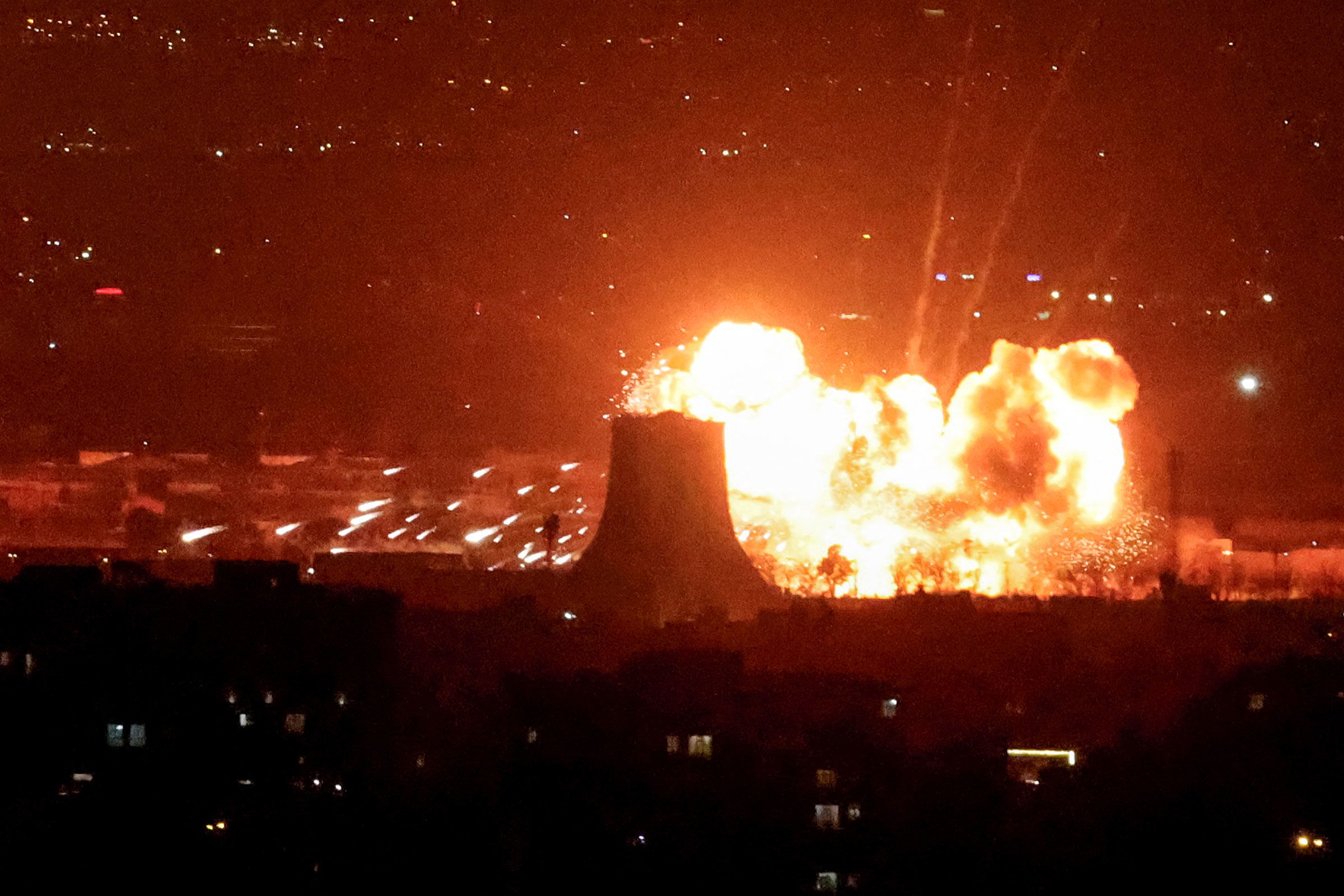 <i>Rami Shlush/Reuters via CNN Newsource</i><br/>A fire blazes after an industrial building and a fuel tanker at Israel's Oil Refineries were hit by debris from an intercepted Iranian missile