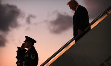 Oil tankers and ships line up in the Strait of Hormuz as seen from Khor Fakkan